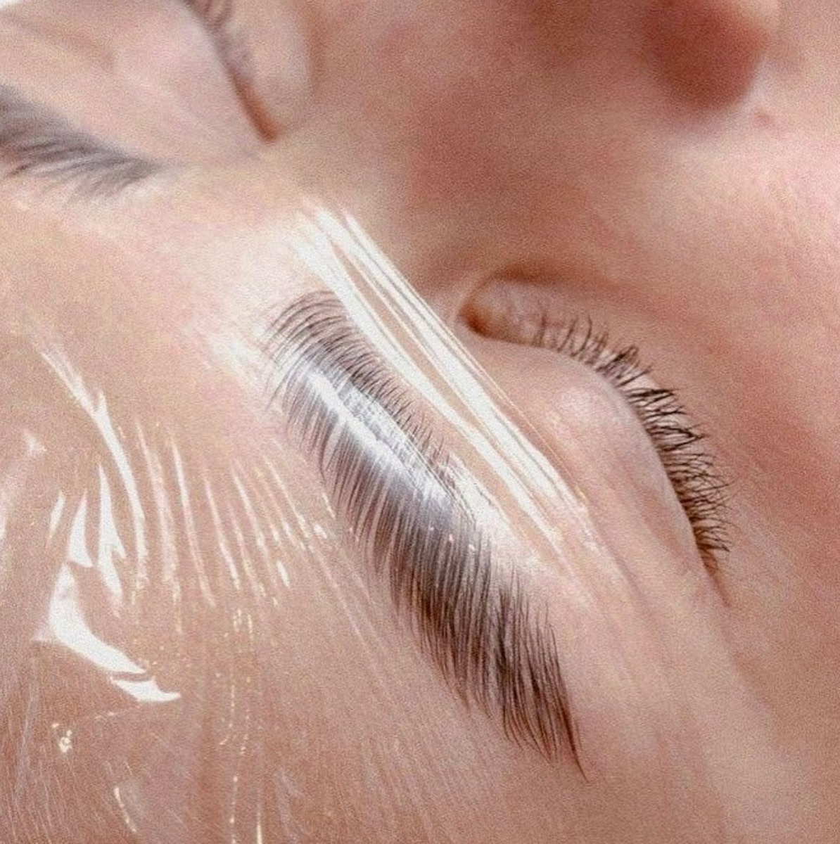 A brow lamination in progress at Blanca, brushed-up hairs setting under conditioning film