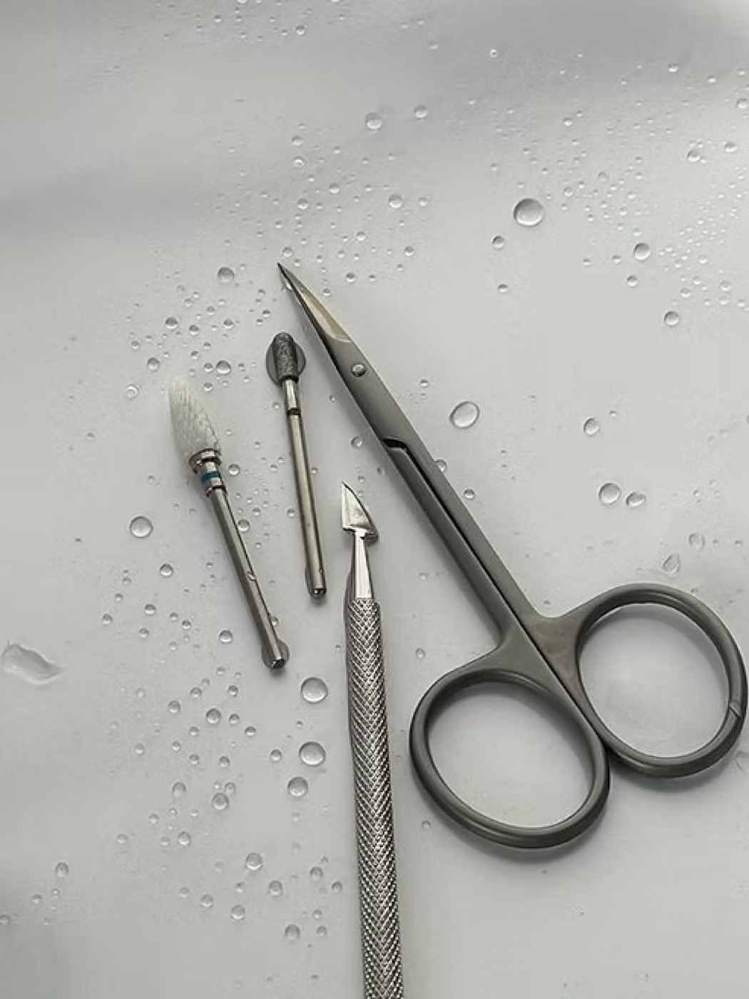 Sterilised nail tools, e-file bits, scissors, cuticle pusher