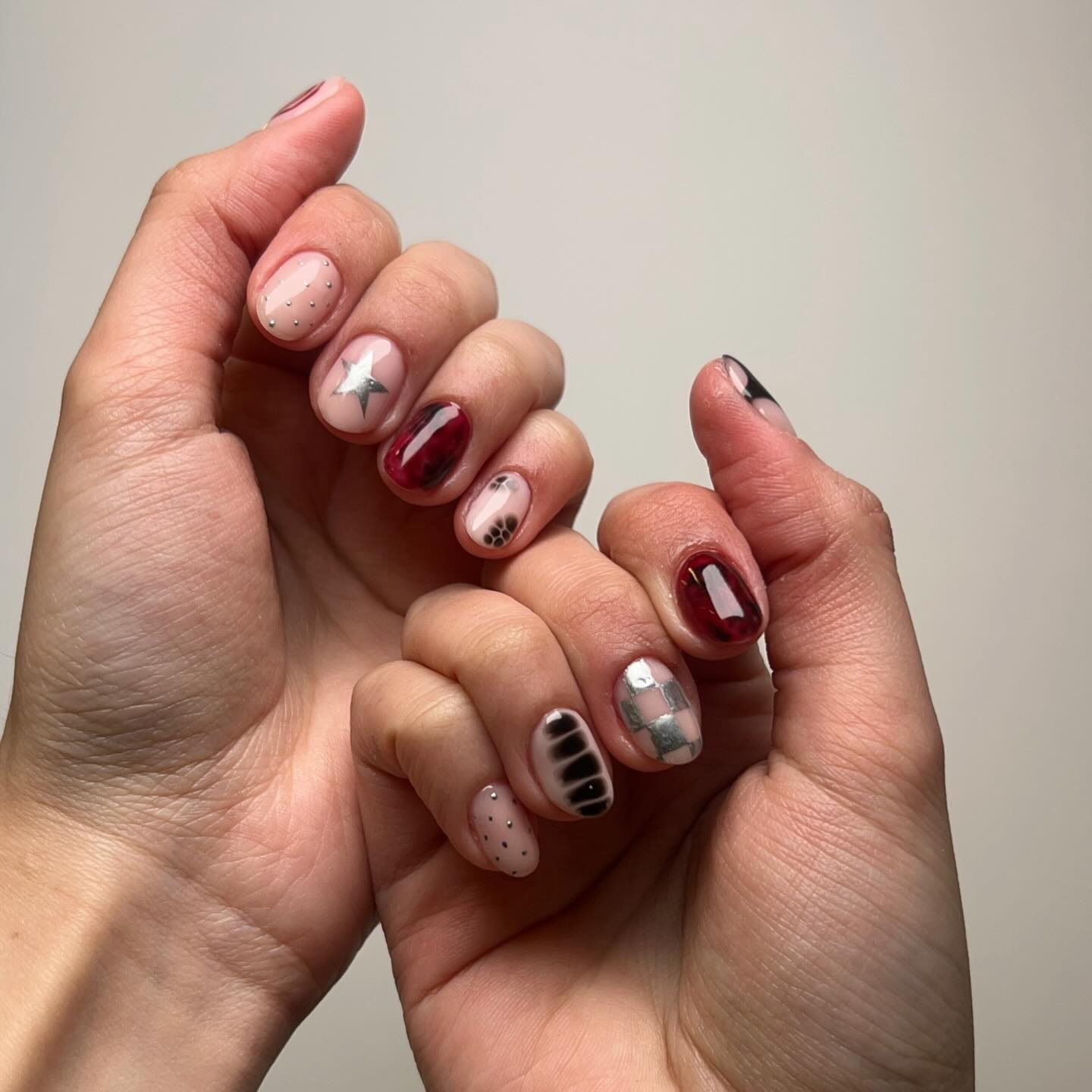 Eclectic short-nail set with stars, paw, checker, stripes